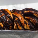 sougdough babka with chocolate top inside a loaf pan