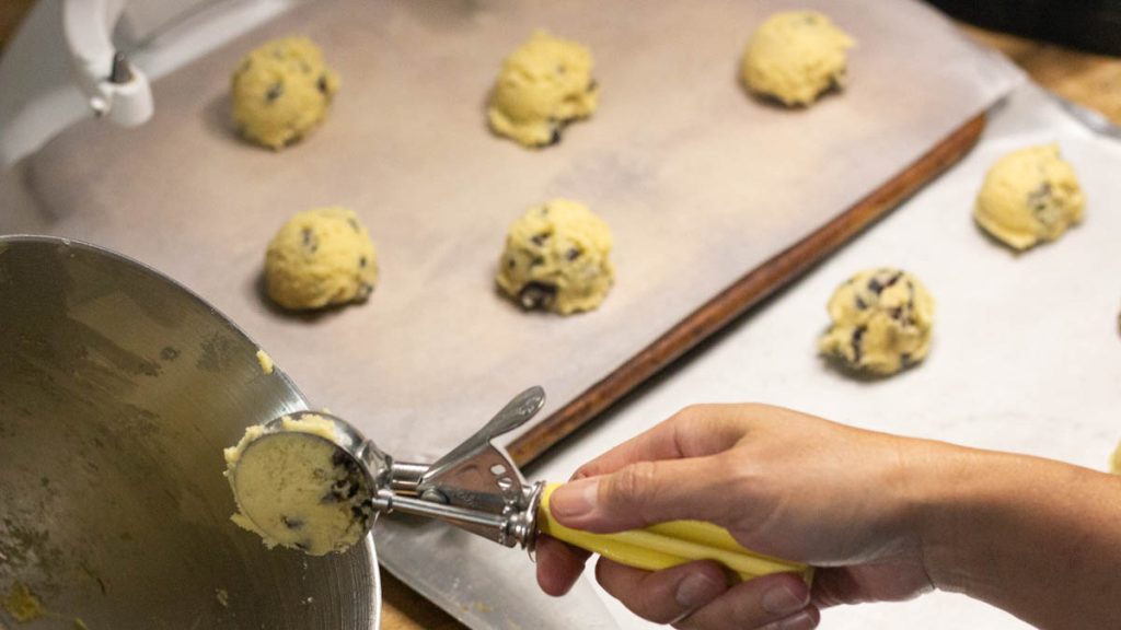 hand scooping we sourdough cookies
