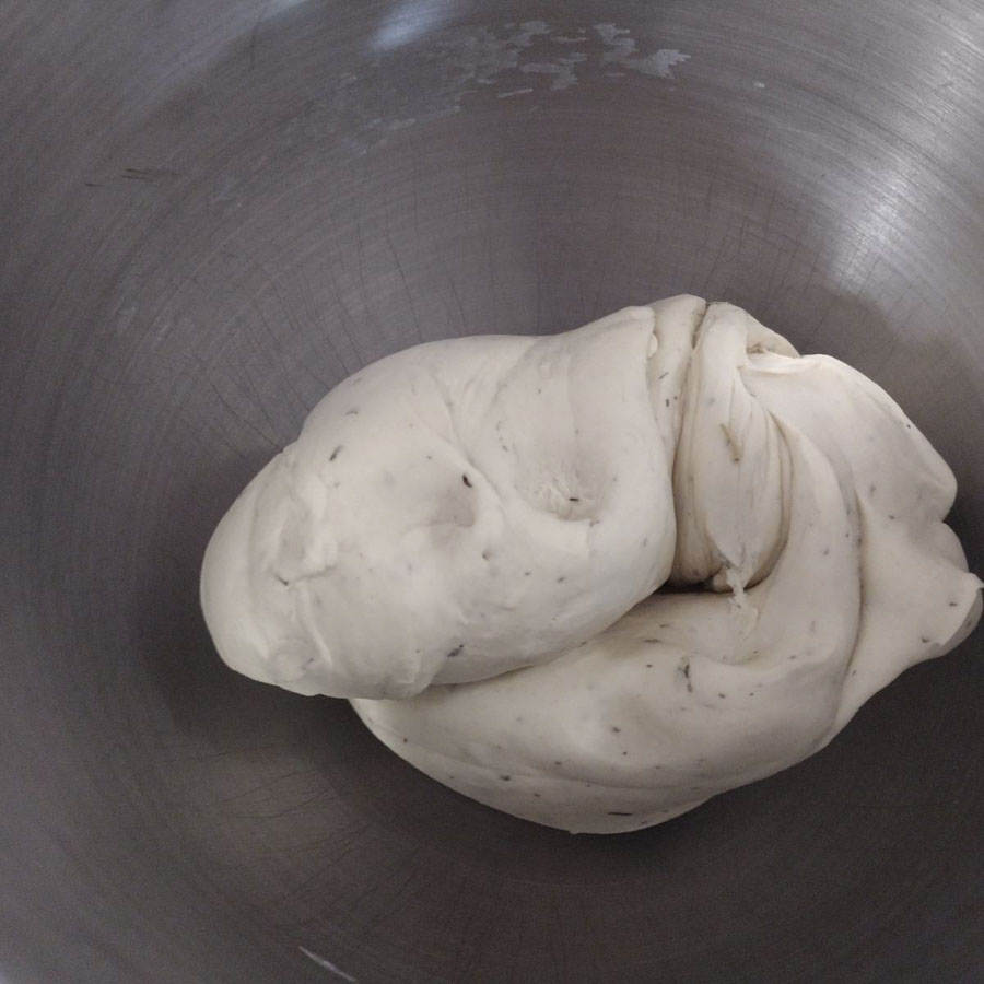 balled sourdough crackers inside mixing bowl