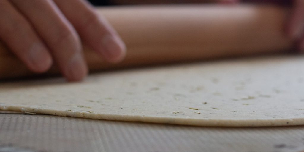 thin flattened dough on surface