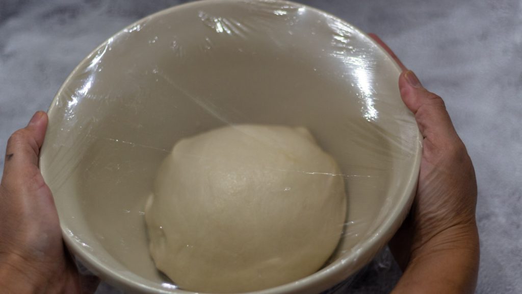 sourdough sandwich wet dough inside mixing bowl