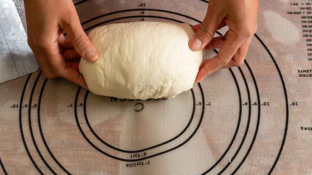 form 3 tucking the ends of the sourdough sandwich bread log forming steps