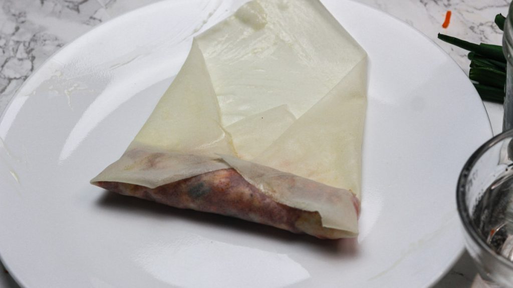 rolled spring roll on a plate step 1