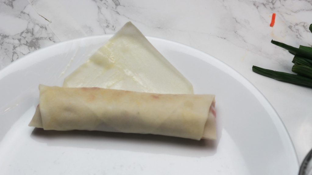 rolled beef spring roll on a plate step 2