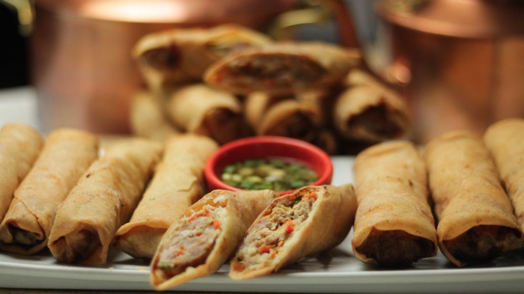 spring roll on a serving plate with sauce